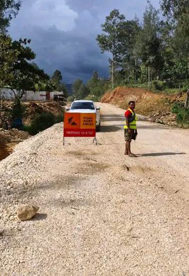Workmen on a section of the Halimbu to Tari road in Hela.