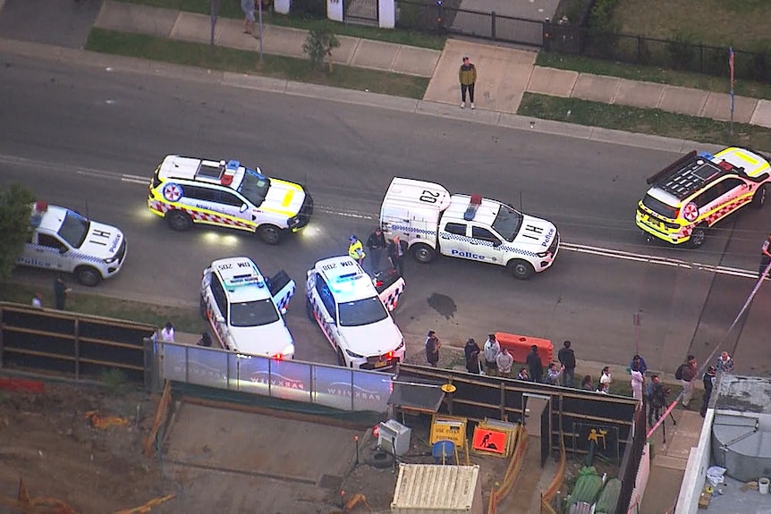 an aerial shot of police cars and ambulances at Fairway Drive in Norwest
